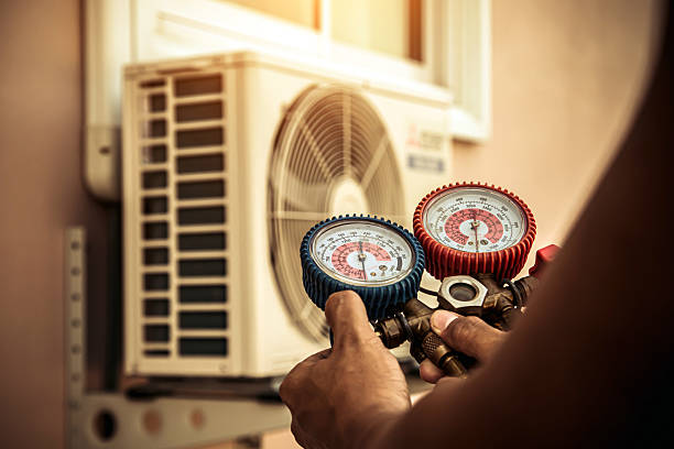 Professional Air Conditioning Service technician working in Sadsburyville, PA